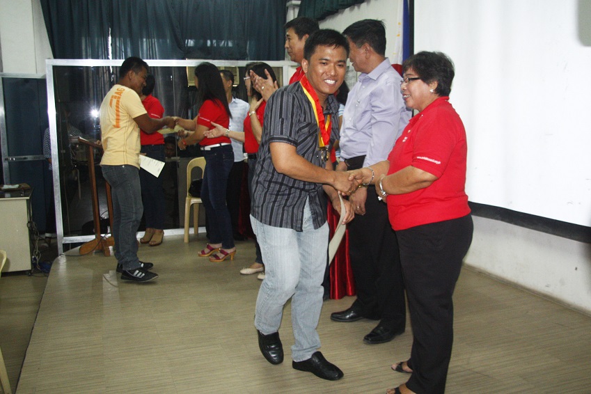 Officials and City PESO Manager Ms. Nilda A. Garcia congratulate 1 of the 21 graduates of the 6th Batch of the Skilled Workers English Enhancement Program (SWEEP) last April 11, 2013 at UM Tagum Campus. The said program and will then undergo an intensive review for the IELTS Exam. Photo by Leo Timogan of CIO Tagum